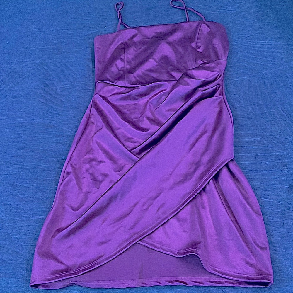 Pink dress with slit left leg. Spaghetti sting straps. Above the knee dress